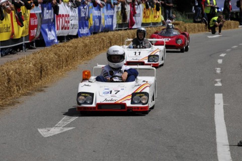 Two people in white racing suits steer their soapboxes during a race, SOLITUDE REVIVAL 2011,