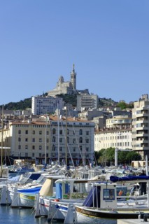 The old harbour, Vieux Port, behind the basilica Notre-Dame de la Garde, Marseille, A view of the