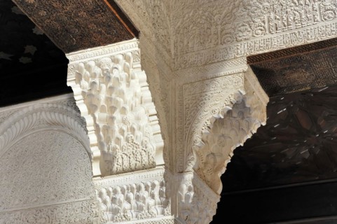 Artistic stone carvings, Alhambra, Granada, Detail of a richly decorated ceiling and columns with