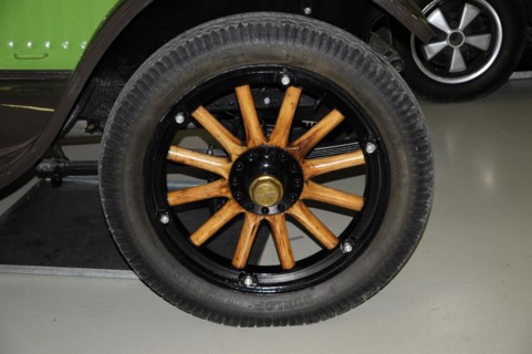 Deutsches Automuseum Langenburg, Close-up of a classic black car tyre with wooden spokes, Deutsches