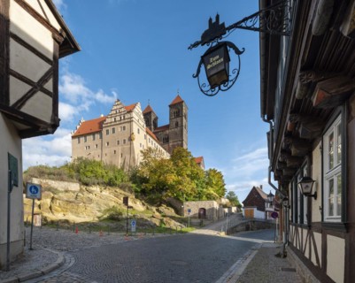 Alley in the historic old town with half-timbered houses and cobblestones, view of the Schlossberg