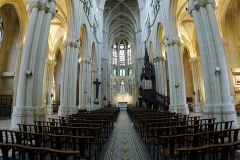 Church of Saint-Vincent-de-Paul, interior view of a church with rows of columns, pews and light