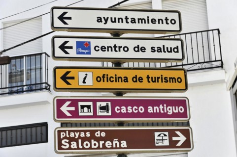 Several signposts with pictograms indicating different tourist destinations, Andalusia, Spain,