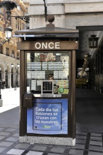 Granada, Lotto kiosk on a corner with posters and billboards on a Spanish street, Granada,
