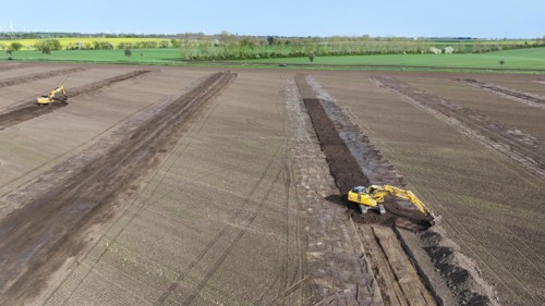 Excavators begin preparations for the construction site access road on the L 50 at the future Intel