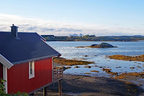 Red building with balcony by the water, Rorbuer, holiday, accommodation, Lovund, Lovunden,