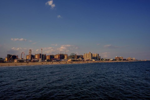 Sun sets on a warm summer day in Coney Island, Brooklyn, NY, USA, USA, North America