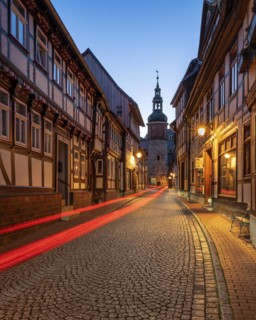 Niedergasse with Saigerturm at dusk, half-timbered houses and cobblestones, Stolberg im Harz,