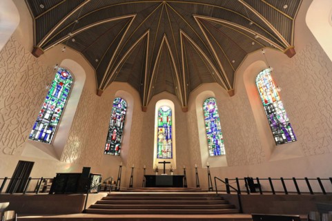 Speyer Cathedral, view of the altar area of a church with pews and special ceiling structure,