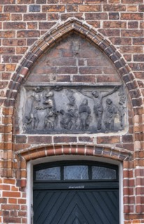 Relief with crucified Christ above a door of the parish church of St Laurentius, Havelberg,