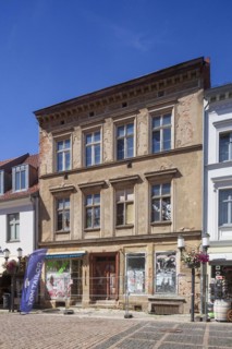 Dilapidated house in need of renovation with barriers in Lange Strasse, Greifswald,