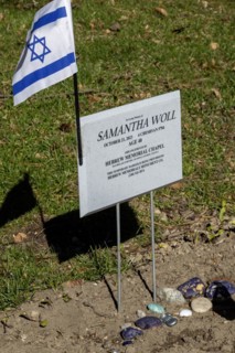 Ferndale, Michigan, An Israeli flag and small stones on the grave of Samantha Woll in Machpelah