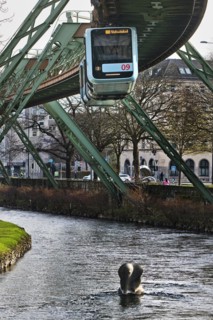 Suspension railway and sculpture by Bernd Bergkemper in the river Wupper commemorating the jump of