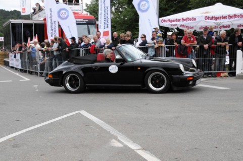 Black Porsche 911 from the side at an event with an audience, SOLITUDE REVIVAL 2011, Stuttgart,