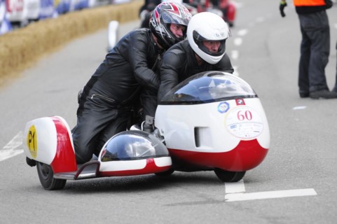 Racer on motorbike with sidecar concentrates on the race, SOLITUDE REVIVAL 2011, Stuttgart,