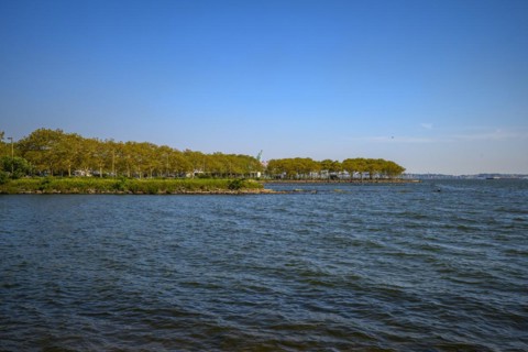 Views on New York Harbor, Manhattan and Statue of Liberty from the Liberty State Park, Jersey City,