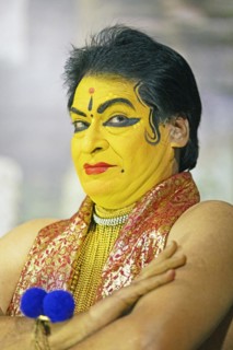 Kathakali performer or mime, 60 years old, with painted face, Kochi Kathakali Centre, Kochi,