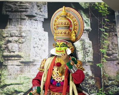 Kathakali performer or mime, 38 years old, on stage at the Kochi Kathakali Centre, Kochi, Kerala,