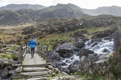 Bridge, woman, Nordic Walking, LLyn Idwal hiking trail, Snowdonia National Park near Pont