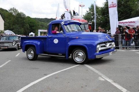 Blue Ford vintage pickup truck at an event with spectators at the roadside, SOLITUDE REVIVAL 2011,