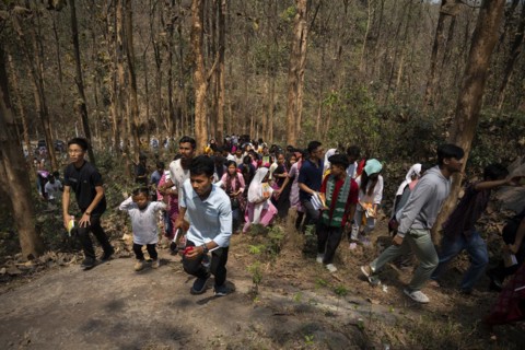 Christian devotees takes part in a perform to re-enactment of the crucifixion of Jesus Christ