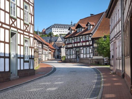 Street with half-timbered houses and cobblestones, behind the castle, Stolberg im Harz,