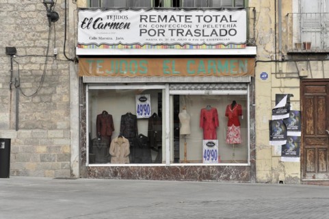 Jaen, Facade of a textile shop with shop window and advertisement for a sale, Jaen, Andalusia,