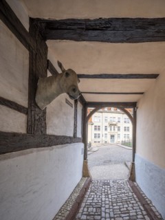 Narrow alley with cobblestones in the historic old town, Schlossgasse, passage through a