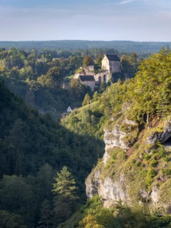 View of the Puettlach valley with rocks, forests and Pottenstein Castle, Franconian Switzerland,