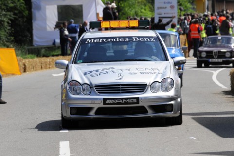 The white Mercedes-AMG safety vehicle on a race track surrounded by spectators, SOLITUDE REVIVAL