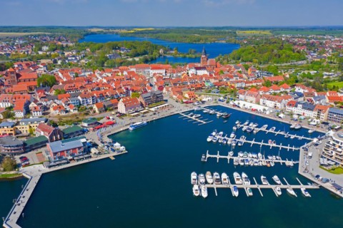 Aerial view over Waren, town and climatic spa on the shores of Lake Mueritz in summer,