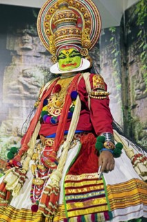 Kathakali performer or mime, 38 years old, on stage at the Kochi Kathakali Centre, Kochi, Kerala,