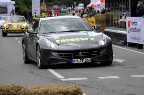 A Ferrari as a pace car on a secured race track surrounded by spectators, SOLITUDE REVIVAL 2011,