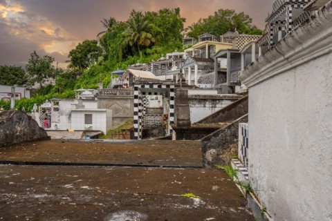Famous cemetery, many mausoleums or large tombs decorated with tiles, often in black and white.