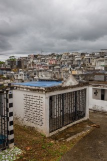 Famous cemetery, many mausoleums or large tombs decorated with tiles, often in black and white.