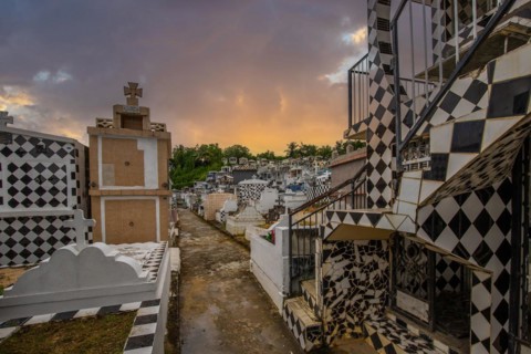 Famous cemetery, many mausoleums or large tombs decorated with tiles, often in black and white.