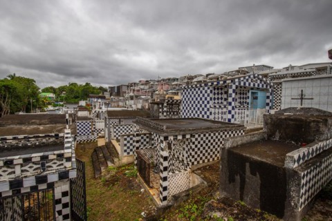 Famous cemetery, many mausoleums or large tombs decorated with tiles, often in black and white.