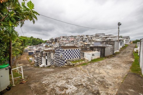 Famous cemetery, many mausoleums or large tombs decorated with tiles, often in black and white.