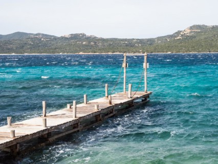 Jetty leading into the sea, Capriccioli beach, Costa Smeralda, Sardinia, Italy, Europe