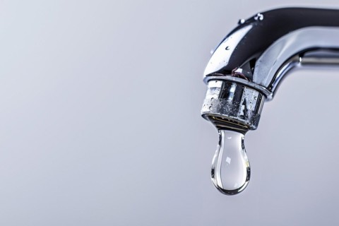 Single drop of water coming out of water tap. KI generiert, generiert, AI generated