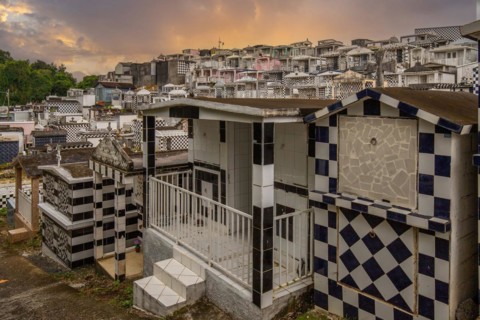 Famous cemetery, many mausoleums or large tombs decorated with tiles, often in black and white.
