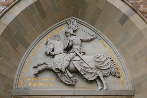 Eagle Gate, stone relief on the outer castle gate, knight figure on horse, armour, inscription,