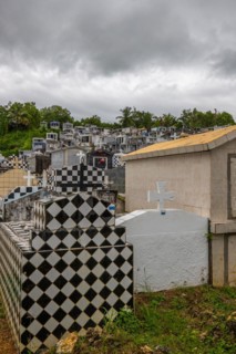 Famous cemetery, many mausoleums or large tombs decorated with tiles, often in black and white.
