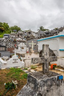 Famous cemetery, many mausoleums or large tombs decorated with tiles, often in black and white.