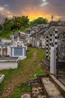 Famous cemetery, many mausoleums or large tombs decorated with tiles, often in black and white.