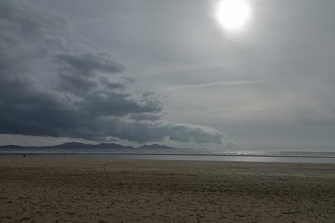 Beach, clouds, mountains, sun, LLanddwyn Bay, Newborough, Isle of Anglesey, Wales, Great Britain