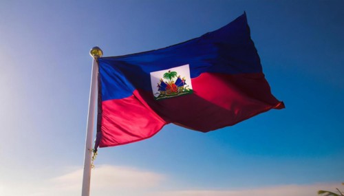 Flags, the national flag of Haiti flutters in the wind