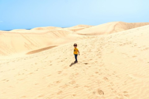 Little boy enjoying in the dunes of Maspalomas, Gran Canaria, Canary Islands