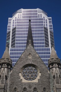 Old Christ Church Cathedral facade with rose window and modern architectural steel and blue tinted