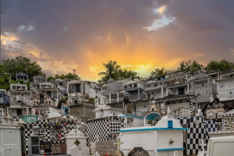 Famous cemetery, many mausoleums or large tombs decorated with tiles, often in black and white.